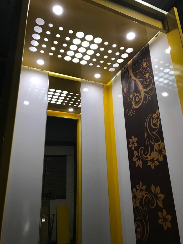 Premium passenger elevator cabin interior with modern lighting and elegant finish